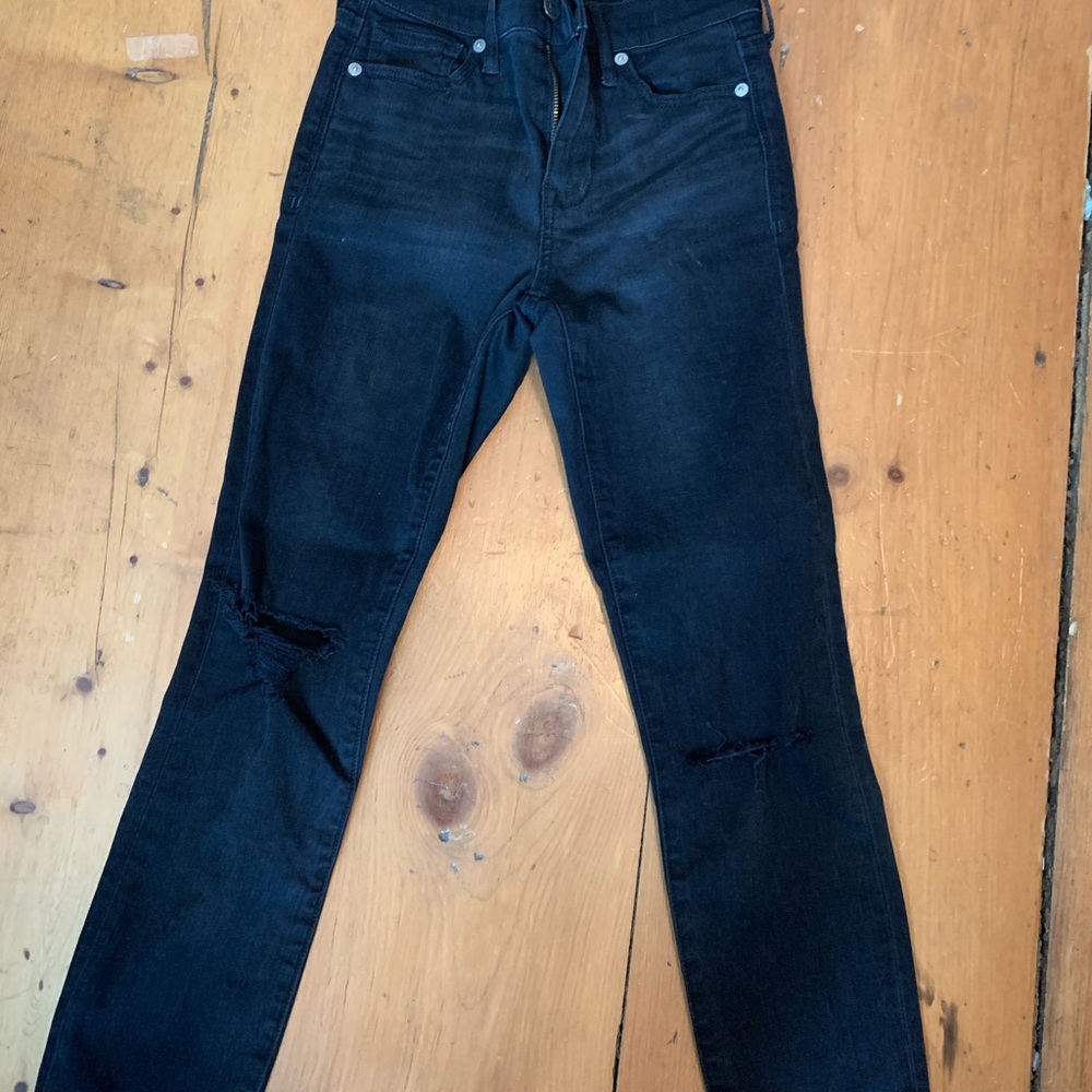 Black Madewell skinny jeans with knee holes